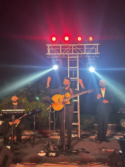We pause between songs on the chess-themed stage, with guitar, keyboards and flute ready at Golfshire.