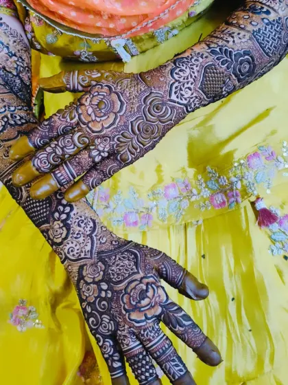 A stunning bridal design with full coverage, featuring the name 'Faraz' on the palm. The rich color and detail are perfect for a bride.