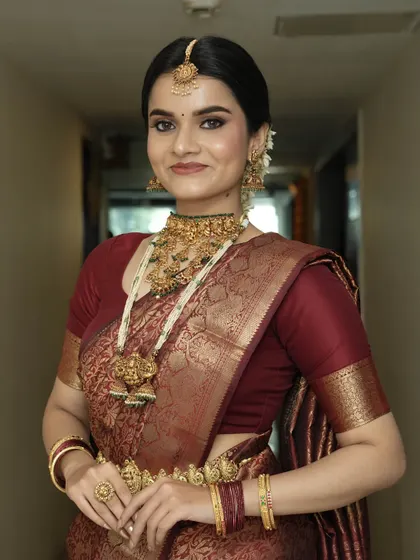 A portrait that captures the timeless elegance of this look. The makeup is flawless, and her smile is infectious.