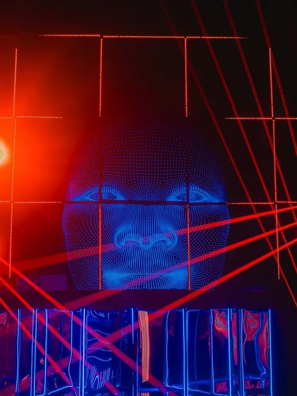 We created this immersive photo installation using a grid of red lasers and a projected digital face. It provided a futuristic and interactive experience for guests.