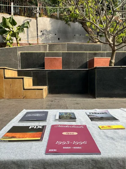Books from a pop-up library arranged on the steps of Nepean Greens, turning the architectural elements into display surfaces.