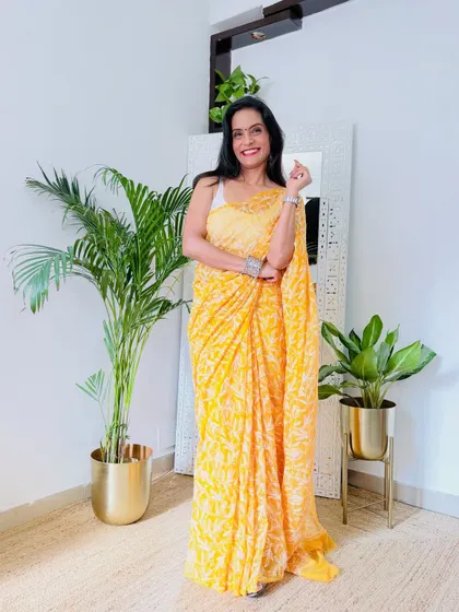 A sunny yellow Chikankari saree that is perfect for a Haldi ceremony or a summer day event. The georgette fabric is flowy and comfortable, and the handwork is just beautiful.