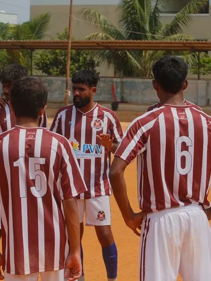 A team huddle before our first C-Division match. Strategy, unity, and a shared goal are what drive us forward.