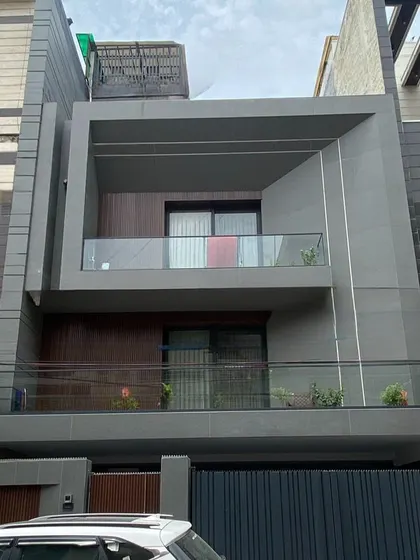 The finished home in Delhi, photographed on-site. The real-world result faithfully captures the architectural intent, proportions, and material palette of the initial 3D render.