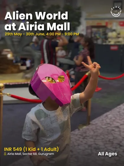 A child in a cool alien mask at the Alien World event, showing the immersive fun.