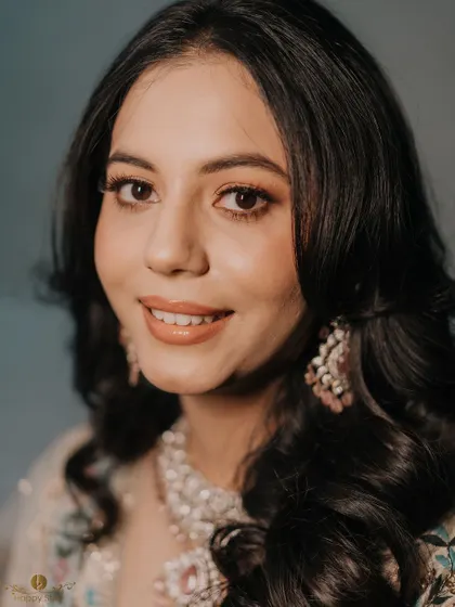 A stunning close-up portrait of the bride-to-be on her engagement day. Her flawless makeup and happy expression are beautifully captured.