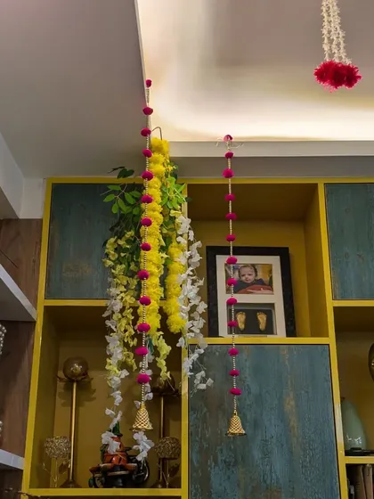 Simple touches like these floral hangings with little bells can make a big difference in creating a festive atmosphere throughout the house.