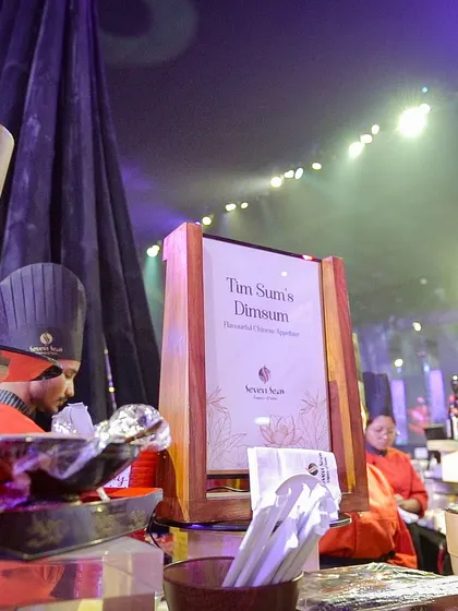 Our "Tim Sum's Dimsum" station, with chefs in traditional attire. The authentic setup and delicious offerings make this a popular and engaging choice for any corporate event.