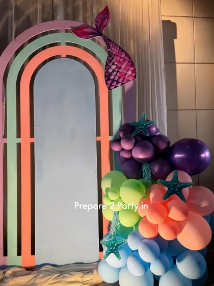 Explore my portfolio of mermaid themed birthday parties, featuring iridescent backdrops, shell-shaped signs, and balloon arrangements that capture the magic of the ocean.
