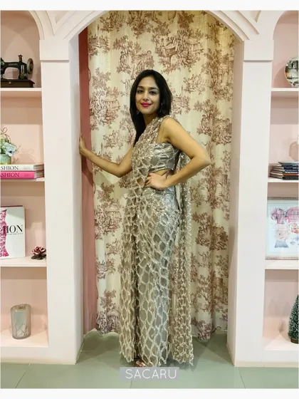 Our client Megha pictured in our signature draped saree dress in sequinned tulle, a perfect head-turning outfit.