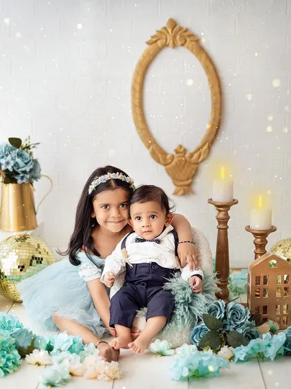 A sweet portrait of a big sister with her baby brother. These photos are a wonderful way to celebrate the new addition to the family.