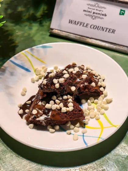 Where crisp meets fluffy. Our chocolate waffles, topped with white chocolate chips, are a warm hug in every bite, served fresh from our live waffle counter.