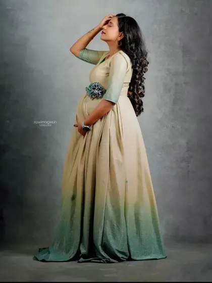 A studio maternity portrait showcasing this elegant ombre gown. I styled her hair in soft curls and kept the makeup minimal to create a graceful and artistic look.