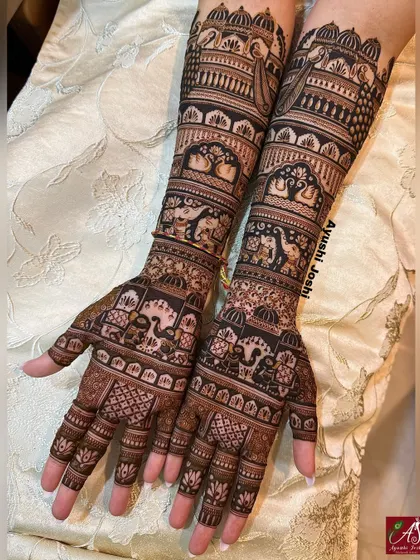 You don't always need figures to make a statement. This is a perfect example of a full, intricate bridal mehendi that is rich with traditional motifs like palaces, peacocks, and elephants, but without any human figures.