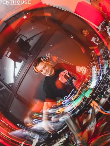 A dynamic, motion-blurred shot from my set in Siliguri. This image captures the high-speed energy and movement of a peak-hour techno set.