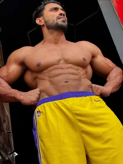 A low-angle shot, making the physique look even more impressive.
