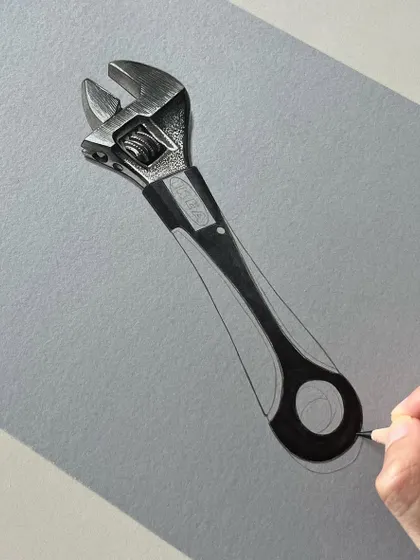 Another view of the wrench drawing as it develops. The handle is starting to take shape as I layer marker and color pencil to create a realistic plastic and metal effect.