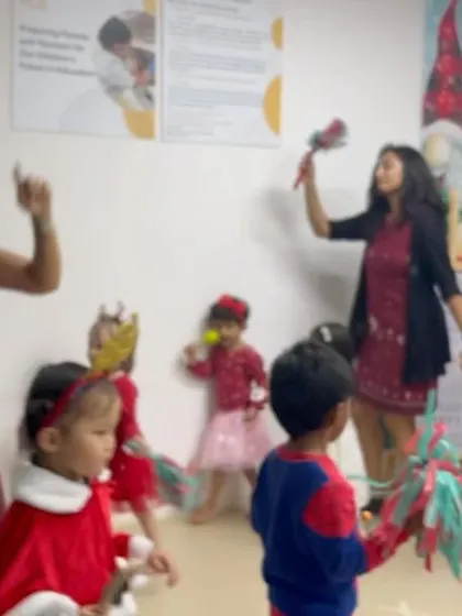 The whole group, including educators, dances with festive props. Our celebrations are interactive and ensure everyone feels part of the fun.