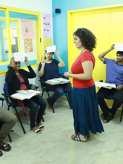 Learning is a game. Here, our students are playing a fun guessing game that helps them practice vocabulary and sentence structure in a relaxed, interactive setting.