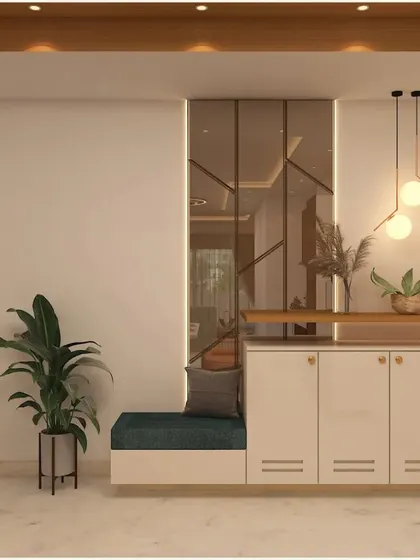 A grand foyer design featuring a beveled mirror wall, a floating storage cabinet with a seating nook, and modern pendant lighting to create a warm and inviting entrance.