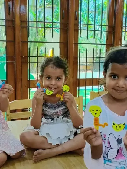 Three girls show off the cute animal stick puppets they made. These puppets are perfect for putting on a show and practicing their storytelling skills.