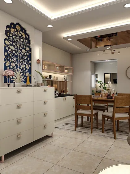 A beautiful crockery unit with a blue Pichwai-style art piece. This design shows how to incorporate traditional Indian art into a modern home in a stylish way.