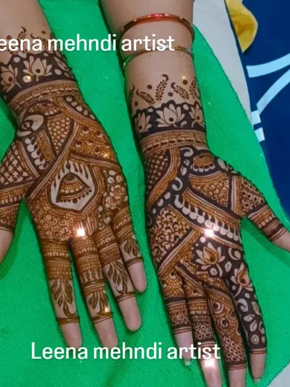 A sparkling, fresh bridal mehndi design. The glitter adds a festive touch for the ceremony, highlighting the intricate patterns of peacocks and kalash motifs before the stain develops.