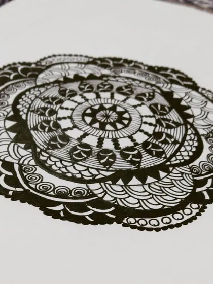 Here is a classic black and white mandala, where the focus is purely on the intricacy of the patterns. Using only black ink on paper, I built this design layer by layer, creating a complex and balanced piece that showcases the beauty of pure line work.