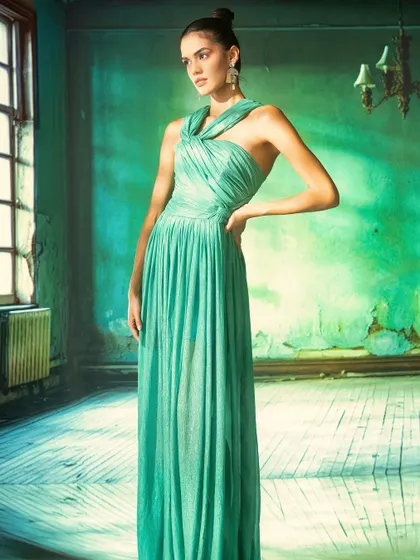 A moody, atmospheric room with peeling green paint, created using projection. This technique is perfect for building a specific character and story for an editorial fashion shoot.