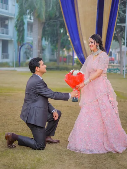 The classic proposal pose during a pre-wedding shoot, a must-have for many couples.