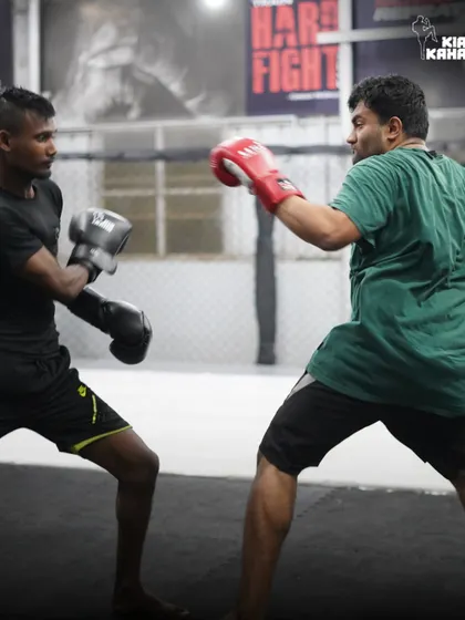 A sparring session in progress. This is where students apply their boxing skills, focusing on timing, defense, and landing clean shots.