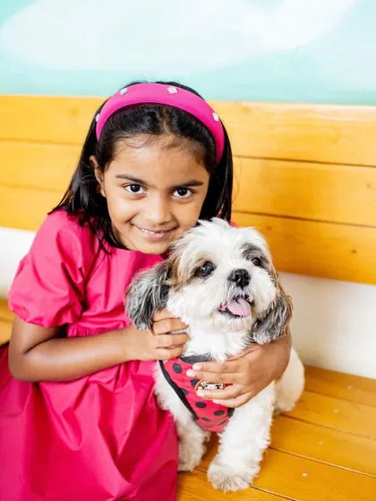 A girl and her best friend. This sweet portrait of a girl hugging her dog shows that pets are a huge part of the family story, and I love including them in photoshoots.