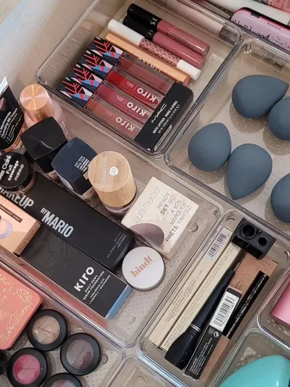 A beautifully organized makeup drawer using sleek acrylic bins. This transforms a beauty routine from chaotic to calm.