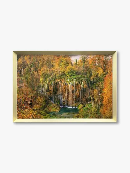 A straight-on view of the custom landscape artwork in a gold metal frame, showing how the frame adds a touch of warmth and elegance.