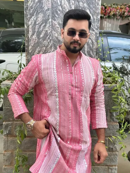 A direct, confident look in my pink kurta. Ready to own the stage.