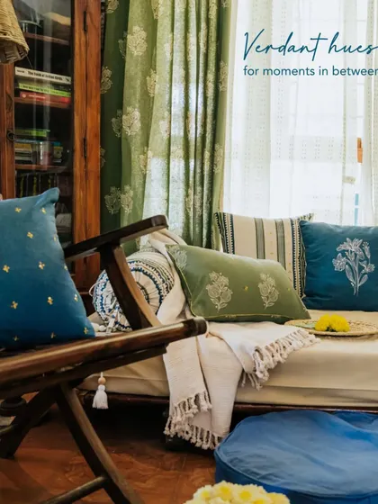 A close-up on the verdant hues and intricate patterns of our cushions. These pieces add layers of texture and color, making this seating area perfect for those quiet moments in between celebrations.