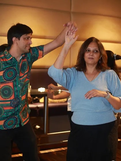 A photo from our social night, paired with our new class schedule. We invite you to join Bangalore's most fun dance community.