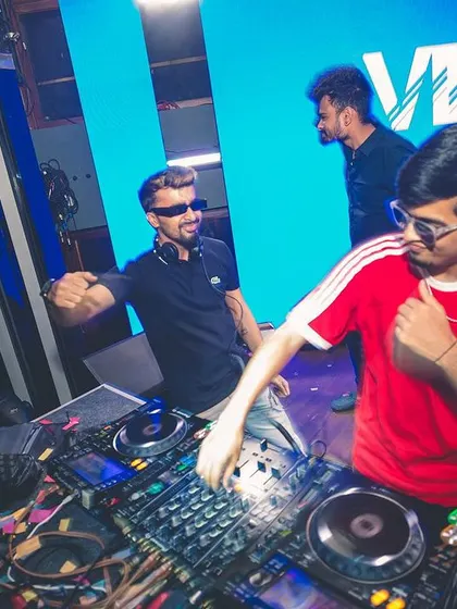 Sharing a fun moment with another DJ in the booth. I love collaborating and creating a dynamic back-to-back set.