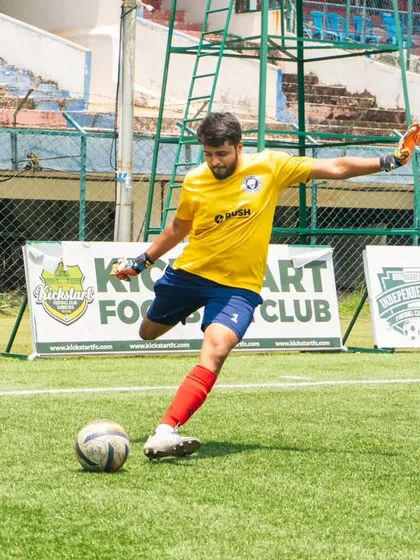 Our captain, launching a long ball during a match. A leader on and off the field.