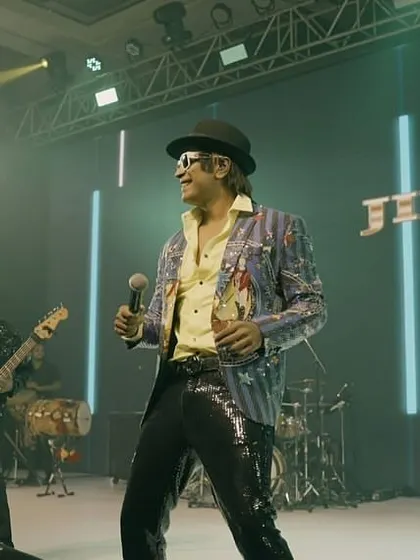 Me and the band locked in a groove. The synergy we have on stage is what creates the seamless, high-energy musical journey for the audience.