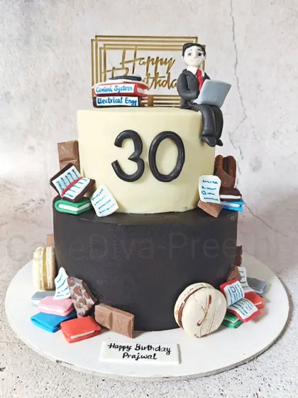 Welcoming the thirties with a cake for a book lover. This tall, two-tone cake is surrounded by dozens of tiny, handcrafted fondant books, with a studious figure on top.