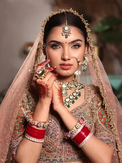 A bride's gaze holds a thousand dreams. We craft timeless bridal looks with meticulous attention to detail, from perfectly blended eyeshadow to a base that glows, ensuring you look nothing less than royalty on your big day.