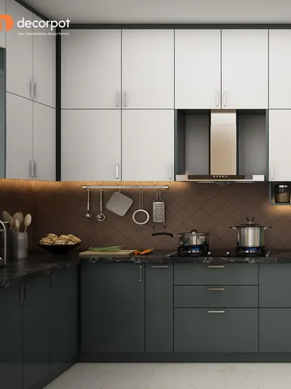 A dark green and white two-tone L-shaped kitchen. The diamond-patterned backsplash adds a unique textural element, while the color combination feels both contemporary and timeless.