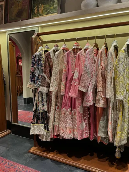 A rack of exquisitely embroidered kurtas and jackets at an Indian designer store. Seeing the craftsmanship up close helps me select the best quality pieces for my clients.
