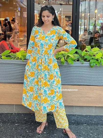 Starting Navratri with a splash of sunshine. This yellow and blue floral printed kurta set, made from pure cotton, reflects the joy and celebration of the festival.