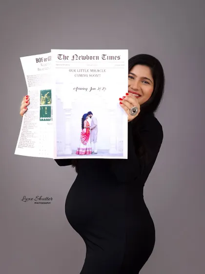 The big reveal! A joyful follow-up to the previous shot, this portrait captures the mother-to-be's happy smile as she shares the news from her "Newborn Times" paper.