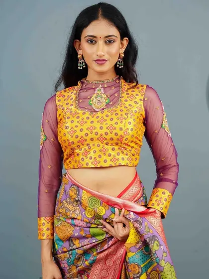 A vibrant yellow blouse with long, sheer purple sleeves, creating a beautiful and unexpected color combination.