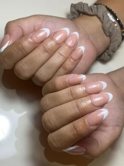 You can't beat a classic. A perfectly executed French manicure on beautifully shaped oval nails. It's timeless, clean, and always in style.