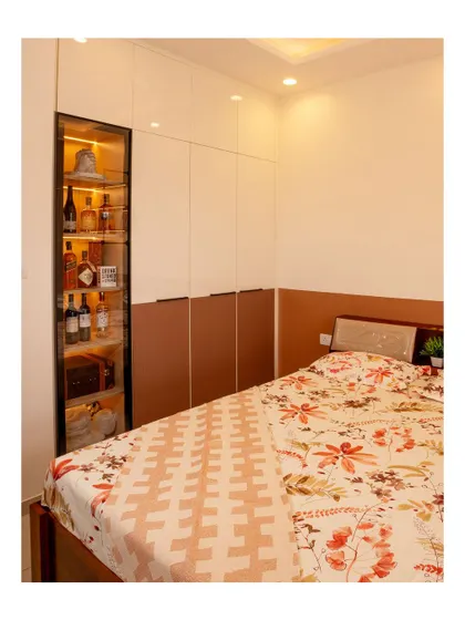 This bedroom features a clever corner unit that serves as a mini bar. It's a great example of how to incorporate unique, personalized features into your space.