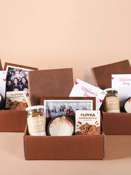 Inside the Wella hampers, we included a personalized photo frame, gourmet treats, and a scented candle. It's a thoughtful mix to show appreciation.